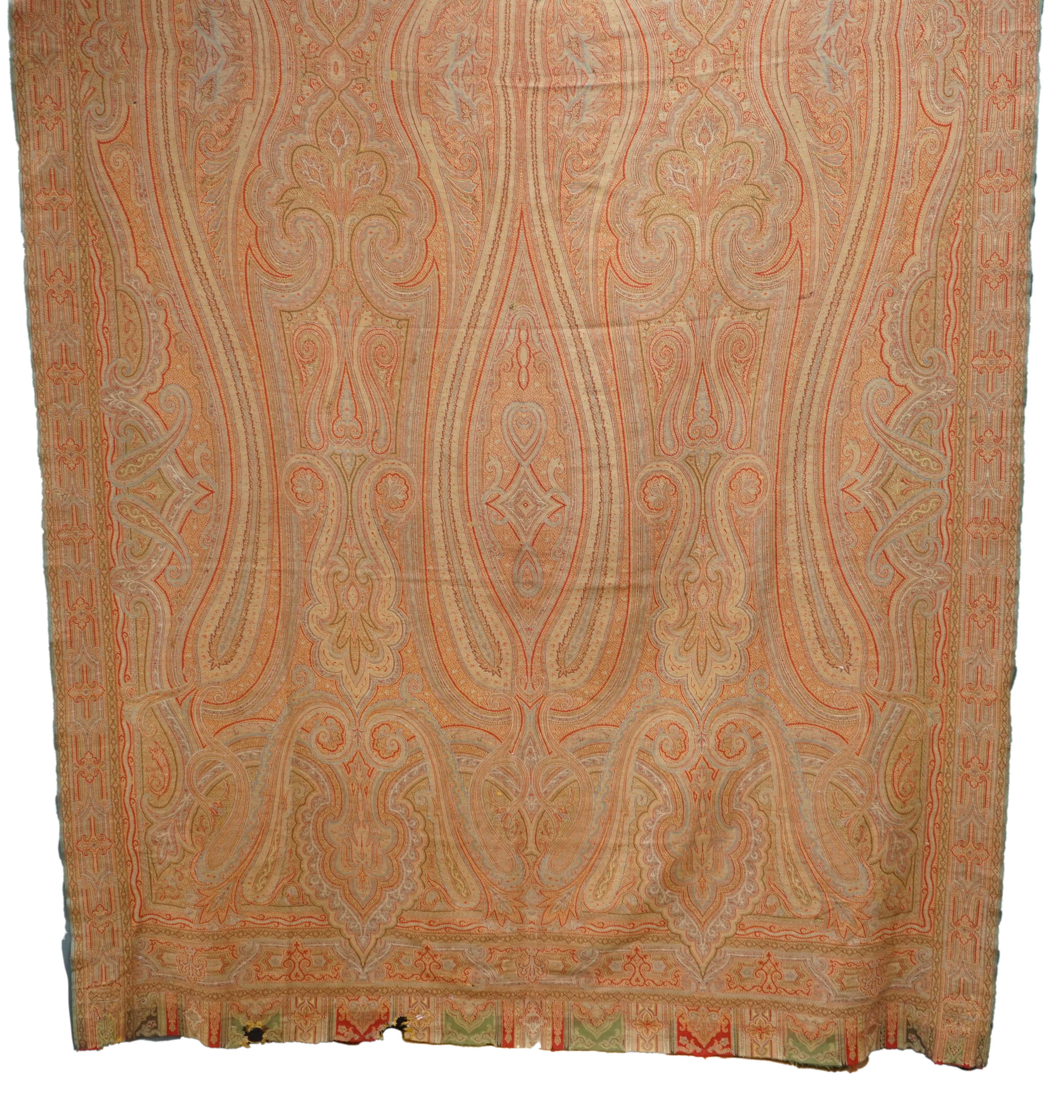 A Victorian wool woven Paisley shawl, designed with a large central tear drop, with intricate paisley design, woven in reds, blues, greens and yellows, the pattern from centre to left and centre to right the same, 160cm